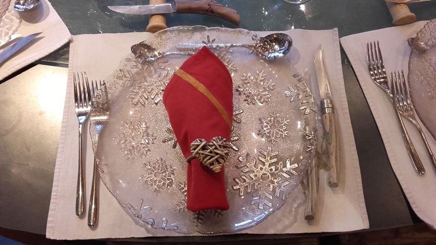 A warmly lit, inviting interior shot of a restaurant space with a subtly blurred background, suggesting anticipation and a welcoming atmosphere for future guests.